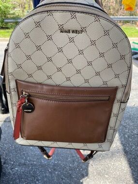 Nine West Beige Logo Backpack with Brown Front Pocket and Red Accent